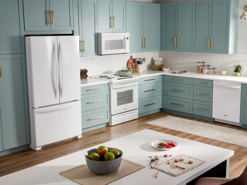 A Whirlpool® French Door Refrigerator with Bottom Freezer in a kitchen setting  A Whirlpool® French Door Refrigerator with Bottom Freezer in a kitchen setting